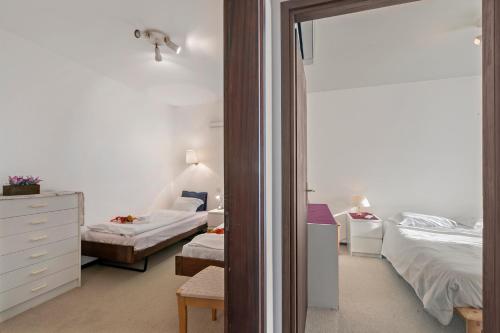 Ένα ή περισσότερα κρεβάτια σε δωμάτιο στο Castel In Aria Apartments