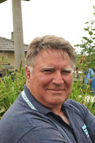 an older man is smiling for the camera at hill view apartment in Welshpool