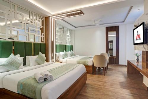 Postel nebo postele na pokoji v ubytování Hotel Saina International New Delhi