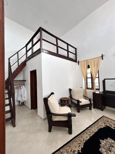 Letto o letti in una camera di Habari House