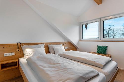 Postel nebo postele na pokoji v ubytování Haus am Hof