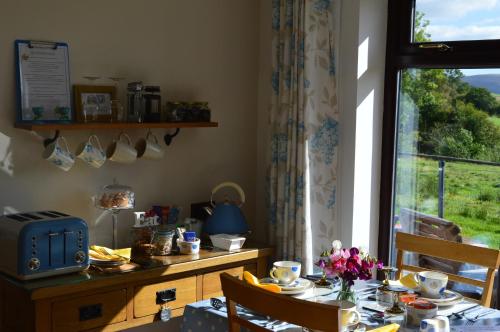 a dining room with a table and a window at Smithfield Farm Bed & Breakfast in Builth Wells