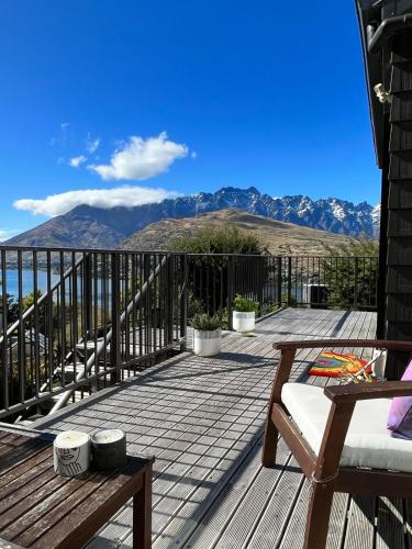 a deck with a view of the mountains at Spectacular Lake and Mountain Views Close to town in Queenstown