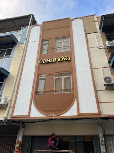 a man standing in front of a casazon ivaza building at Casanova Penuin Batam in Nagoya
