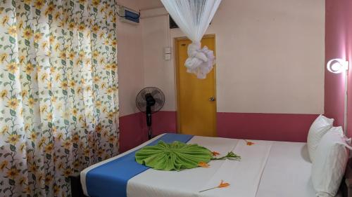 Ένα ή περισσότερα κρεβάτια σε δωμάτιο στο Chill hut home stay