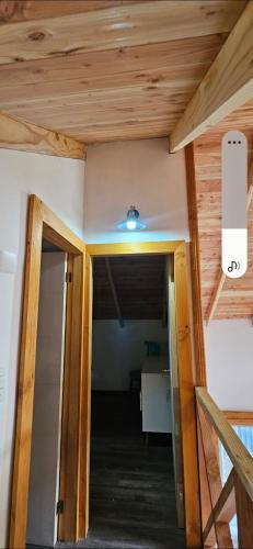 a hallway in a house with a ceiling at Nordica D in Coñaripe