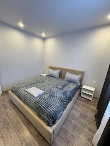 a bedroom with a bed with a laptop on it at Kolsay Lakes in Saty