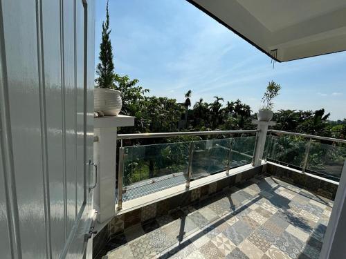 a balcony with a view of the ocean at Choudhury's Stay Barpeta Road in Helāpākari