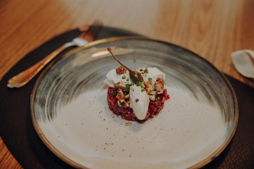 a dessert in a glass plate on a table at Hotel Glockenstuhl in Westendorf