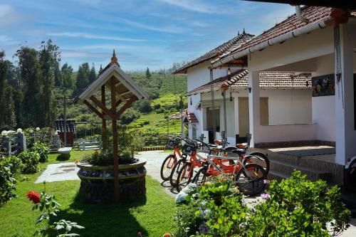 a group of bikes parked outside of a house at Green Leaves The Countryside Inn in Ooty