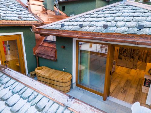an overhead view of a house with a window and a barrel at Hotel San Lorenzo in Bormio