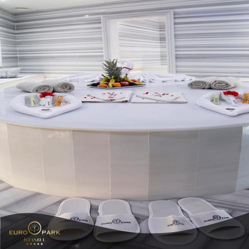 a large white table with plates of food on it at Euro Park Otel in Istanbul