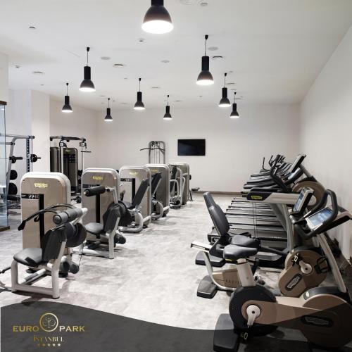 a gym with a lot of treadmills and machines at Euro Park Otel in Istanbul