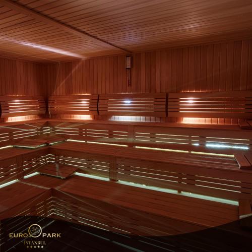 an empty courtroom with wooden benches and lights at Euro Park Otel in Istanbul