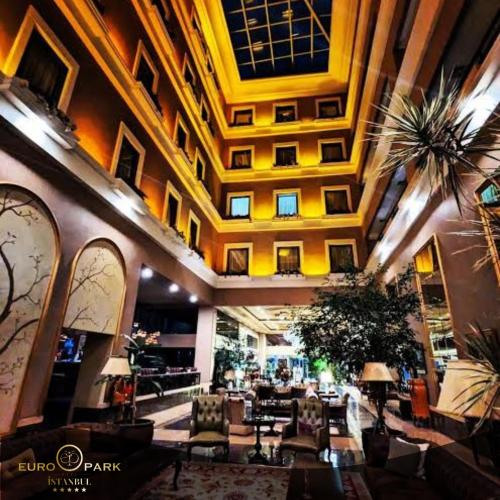 a lobby with couches and tables in a building at Euro Park Otel in Istanbul