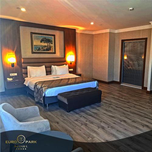 a hotel room with a bed and a chair at Euro Park Otel in Istanbul
