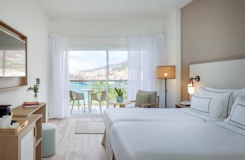 Ένα ή περισσότερα κρεβάτια σε δωμάτιο στο Meliá La Palma