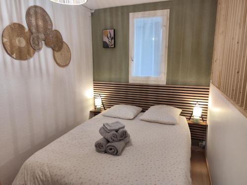 Ένα ή περισσότερα κρεβάτια σε δωμάτιο στο appartement bord de mer et parking privé