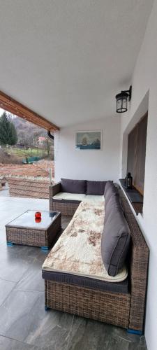 a bedroom with a bed and a couch and a table at Roca Room in Atias