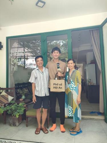 a group of three people posing for a picture at Okra Hoian in Hoi An