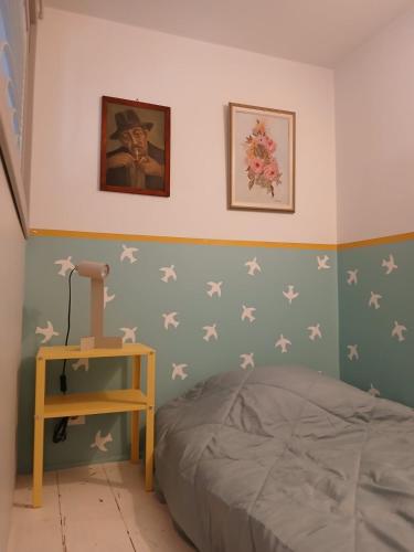 a bedroom with a bed with stars on the wall at Σπίτι - Κάστρο πάνω από τη θάλασσα in Piraeus