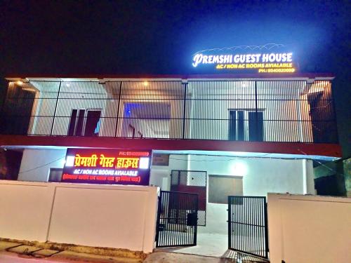 akritkrit guest house with a sign on top of it at Premshi Guest House in Ayodhya