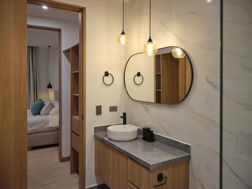 a bathroom with a sink and a mirror at Villa Milá in Salento
