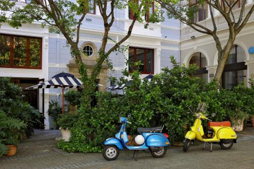 two scooters parked in front of a building at Labotessa Luxury Boutique Hotel in Cape Town