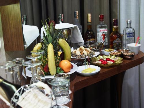 a table filled with food and bottles of wine at Euro Park Otel in Istanbul
