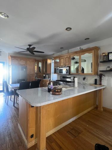 a kitchen with a large island in a room at Eco-Friendly Sunnyside 3 Bedroom Bungalow in Denver