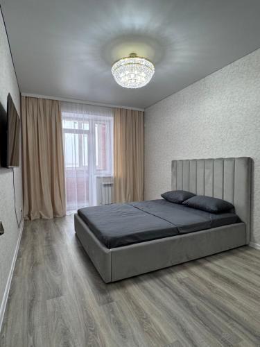 Ένα ή περισσότερα κρεβάτια σε δωμάτιο στο Rich home