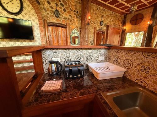 a kitchen with a counter with a coffee maker on it at Villa Wolfsbau in Pai