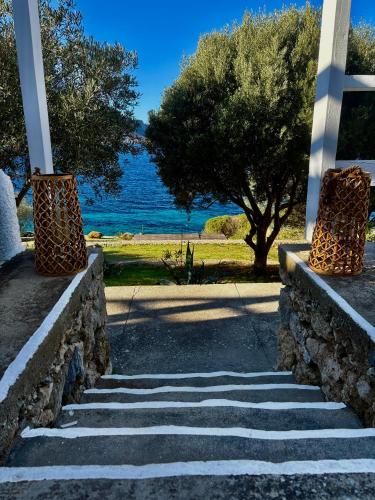 a set of stairs with a view of the water at Armeos Blue in Myrties