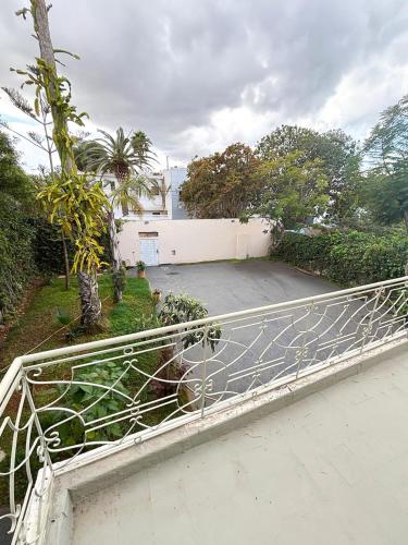 a metal fence in front of a driveway at Spacious villa in Rabat
