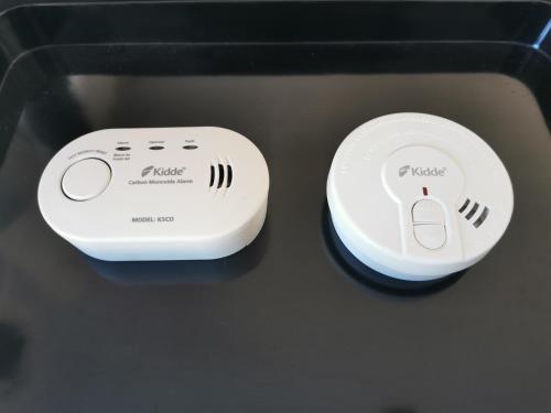 two electronic devices sitting on top of a table at Principato di Baragallo - Free Private Parking in Sanremo