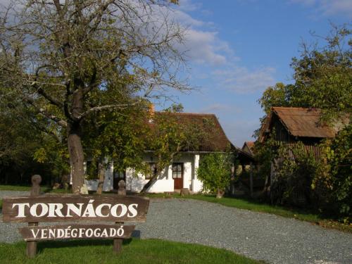a sign in front of a house at Őrségi Tornácos Vendégfogadó in Felsőszenterzsébet