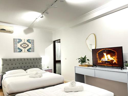 Postel nebo postele na pokoji v ubytování Tirana Square Hotel