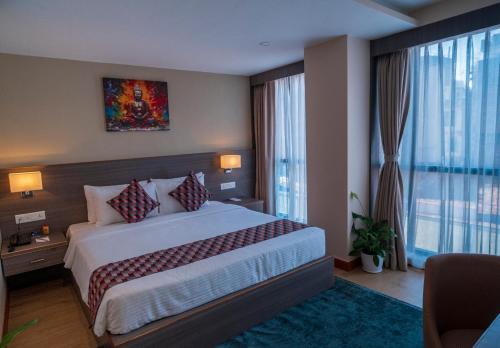 Postel nebo postele na pokoji v ubytování Siddhartha Hotel Damauli