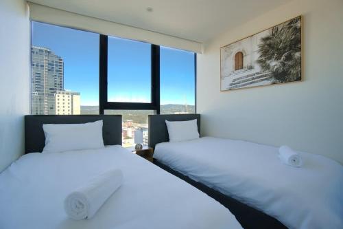 Katil atau katil-katil dalam bilik di New and Modern 2BR Gem in Rundle Mall