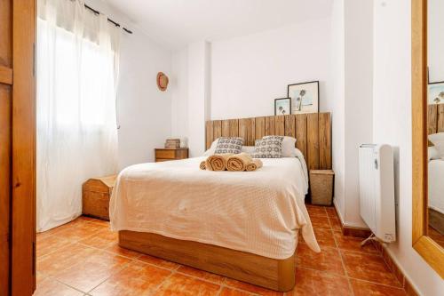 Ένα ή περισσότερα κρεβάτια σε δωμάτιο στο Alzeina, casa con mucho encanto a 300mtr de la playa