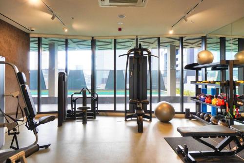 a gym with a bunch of equipment in a room at Rundle Retreat - 2BR Apartment with stunning views in Adelaide