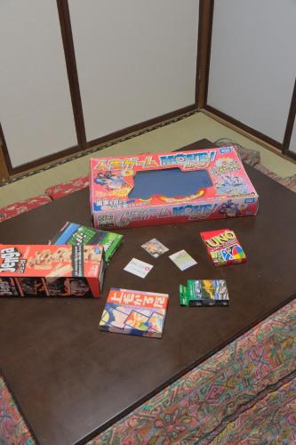 a table with three boxes of presents on it at KARASUYA GuestHouse in Takasaki