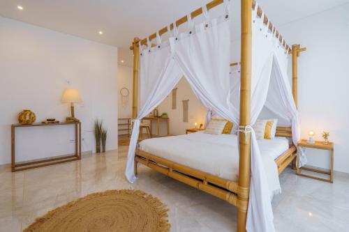 a bedroom with a bed with a canopy at Paradise Villa Sky - Signature by Paradise Portugal in Ribamar