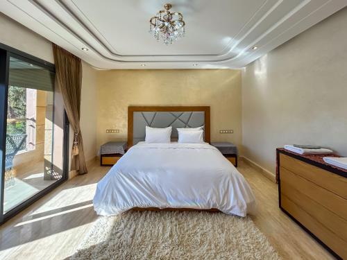 Cama o camas de una habitación en Villa Caprice Palace au centre-ville