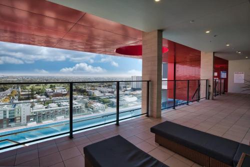 a view from the balcony of a building with a pool at Modern 2 Bedroom Apartment - Adelaide CBD in Adelaide