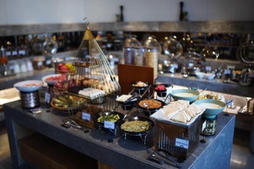 a buffet with many different types of food on a table at Best Western Swaran Amritsar in Amritsar