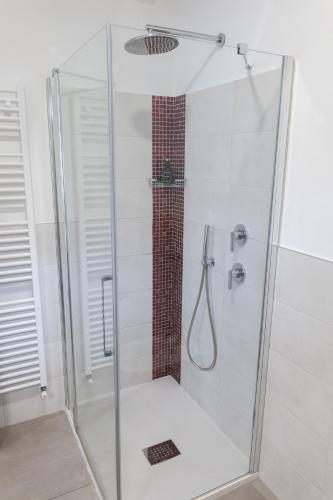 a shower with a glass door in a bathroom at B&B I LAKE IT BELLAGIO in Bellagio