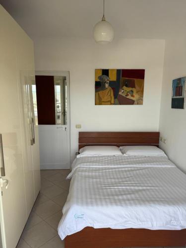 a bedroom with a large bed in a room at ApartHotel by Comfort Suites in Golem