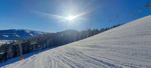L'établissement Das Kaiserwohl Chalet en hiver