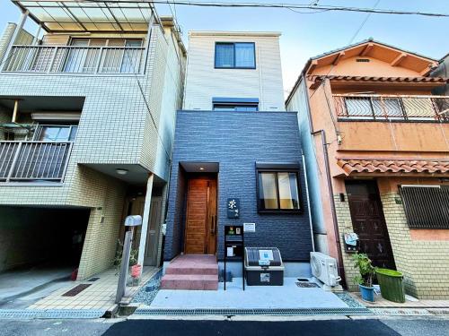 a building with a parking meter in front of it at 栄-晴山 in Osaka